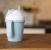 Великденско КОМБО: Babylonia Утешителче от органичен памук по избор + Bo Jungle: Eco-friendly чаша с дръжки и сламка "Синьо" + Bo Jungle: Сет от силиконови лъжички за хранене - 3 бр. "Бяло/Сиво/Синьо"